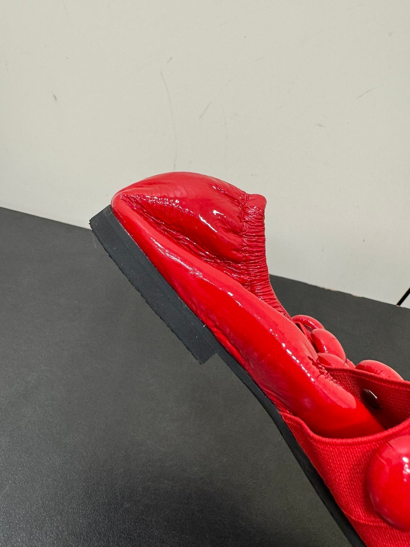 ALAIA SPHERE BALLET FLATS IN CHERRY RED LAMBSKIN