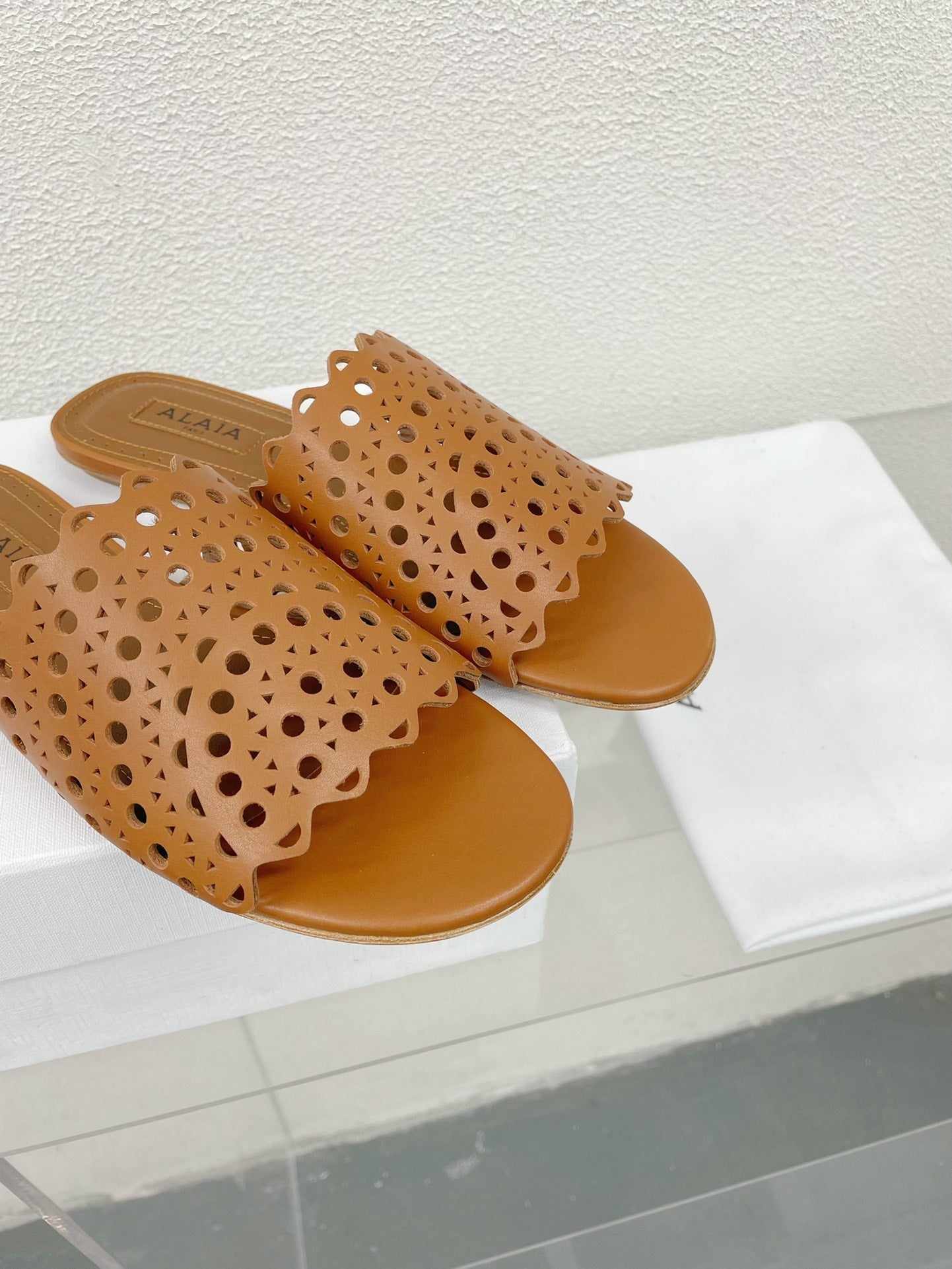 ALAIA VIENNE FLAT MULES IN CHOCOLATE BROWN LAMBSKIN