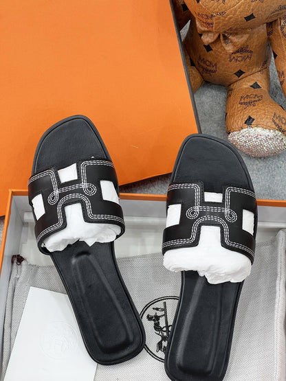 0ran sandal black white epsom