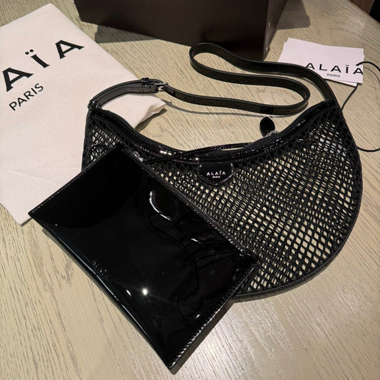 ALAIA ONE PIECE half-moon bag black patent leather 243053