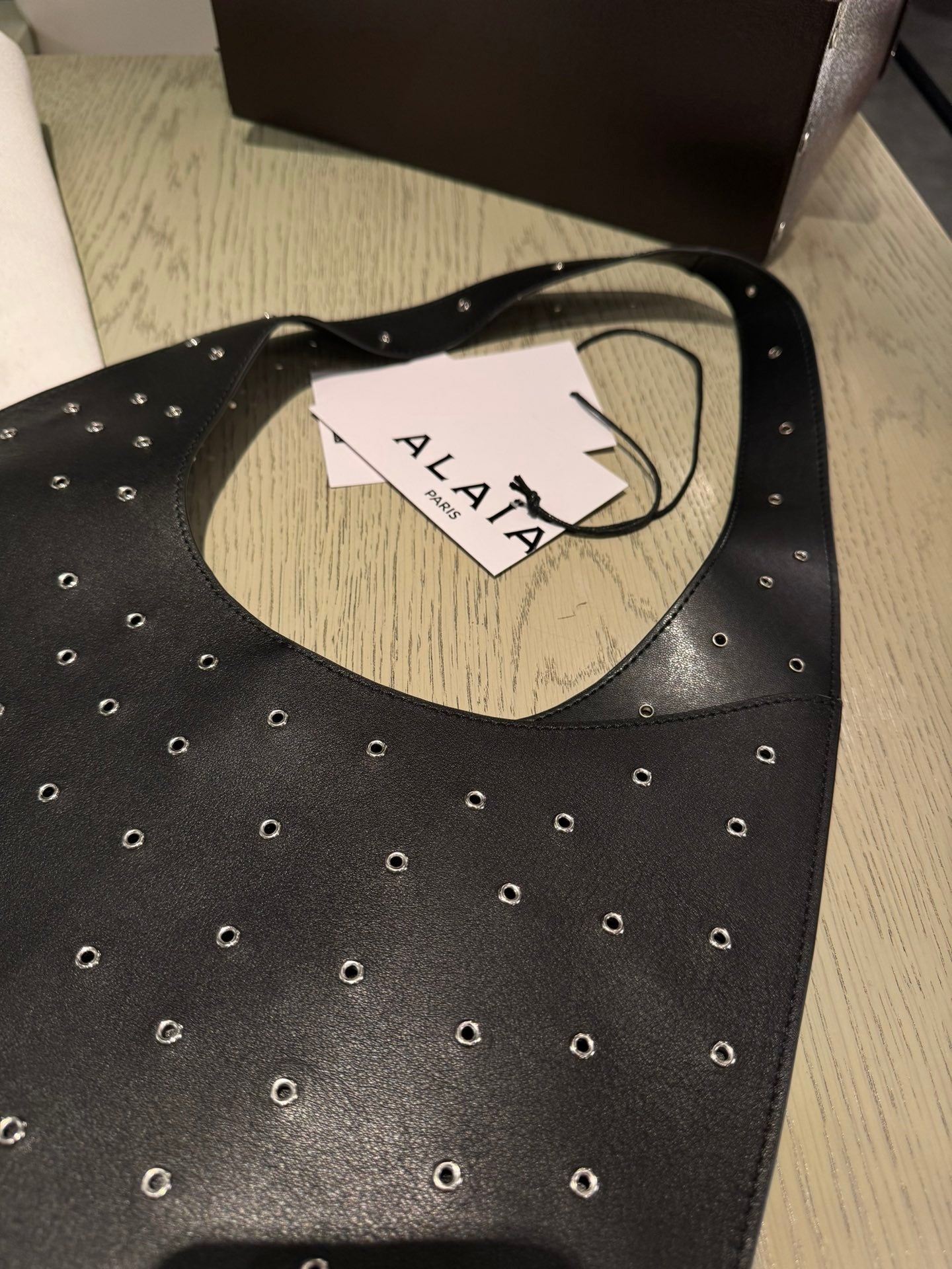 ALAIA Medium Hobo Flat Bag Metal Rivet Black Calfskin 243053