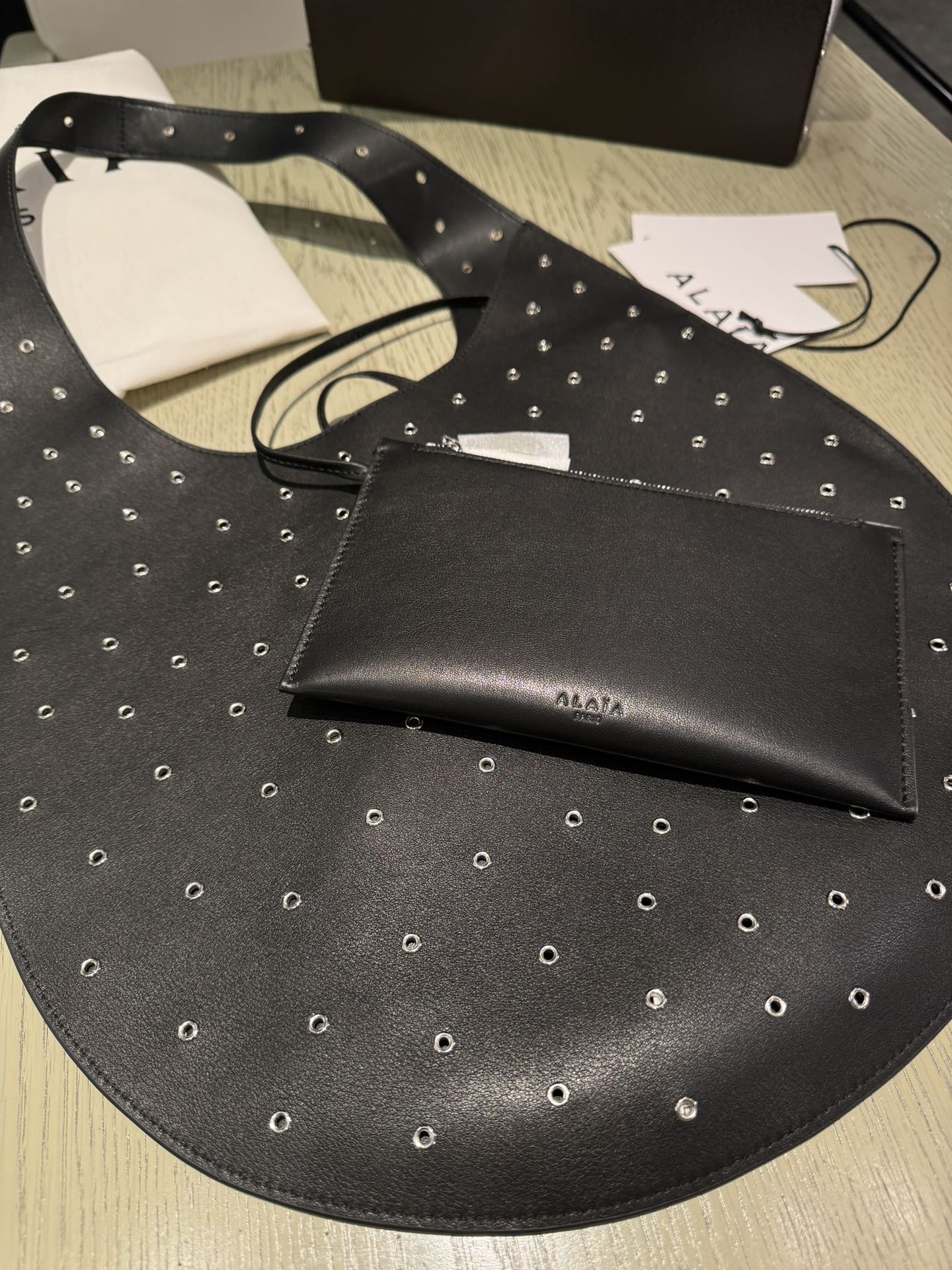 ALAIA Medium Hobo Flat Bag Metal Rivet Black Calfskin 243053