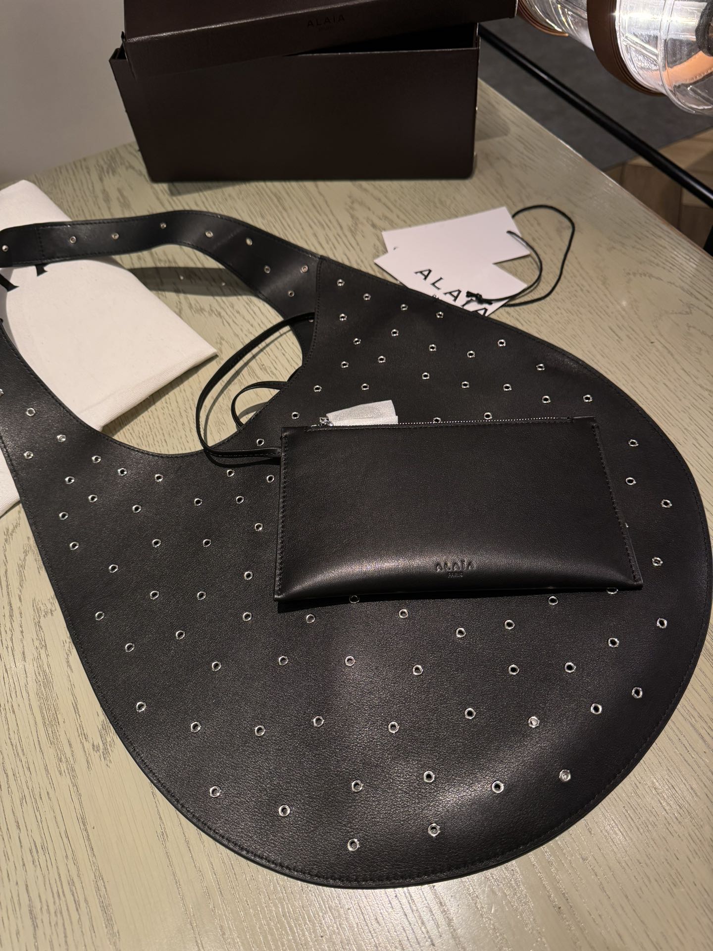 ALAIA Medium Hobo Flat Bag Metal Rivet Black Calfskin 243053