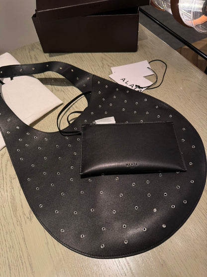 ALAIA Medium Hobo Flat Bag Metal Rivet Black Calfskin 243053