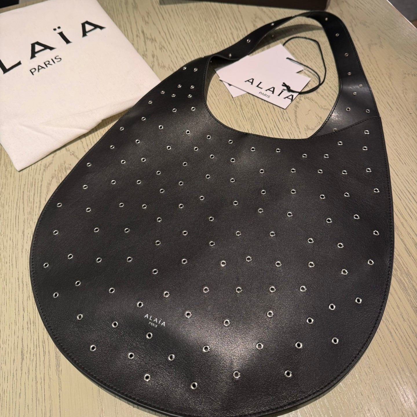 ALAIA Medium Hobo Flat Bag Metal Rivet Black Calfskin 243053