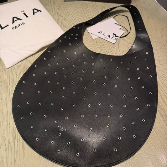 ALAIA Medium Hobo Flat Bag Metal Rivet Black Calfskin 243053