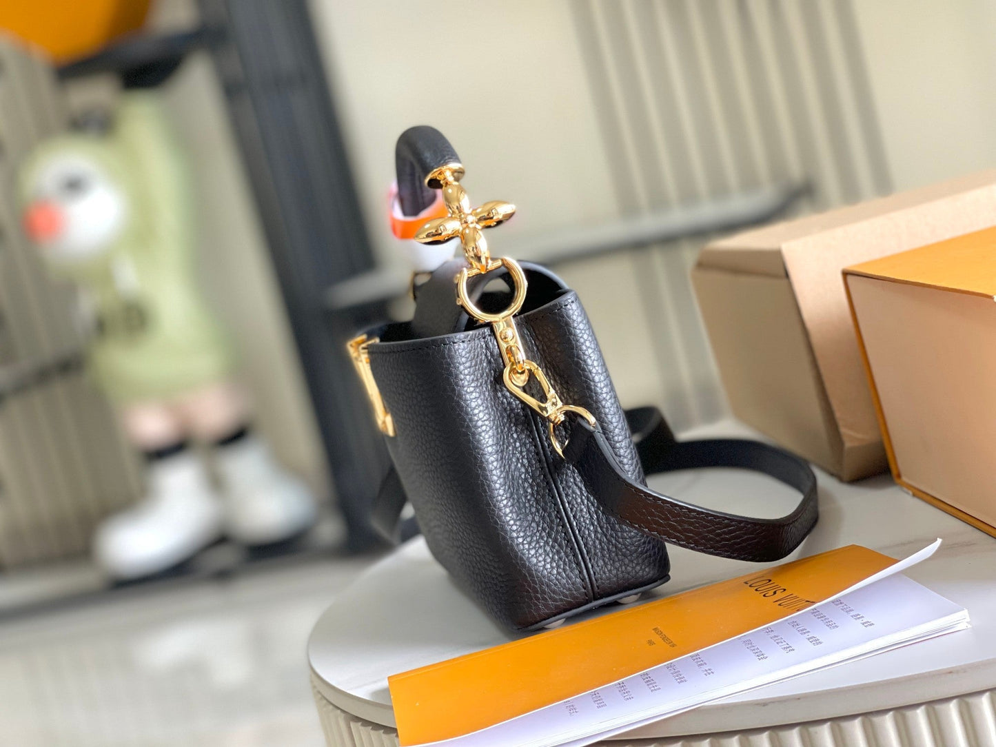 CAPUCINES MINI 21 BLACK TAURILLON GOLD HARDWARE