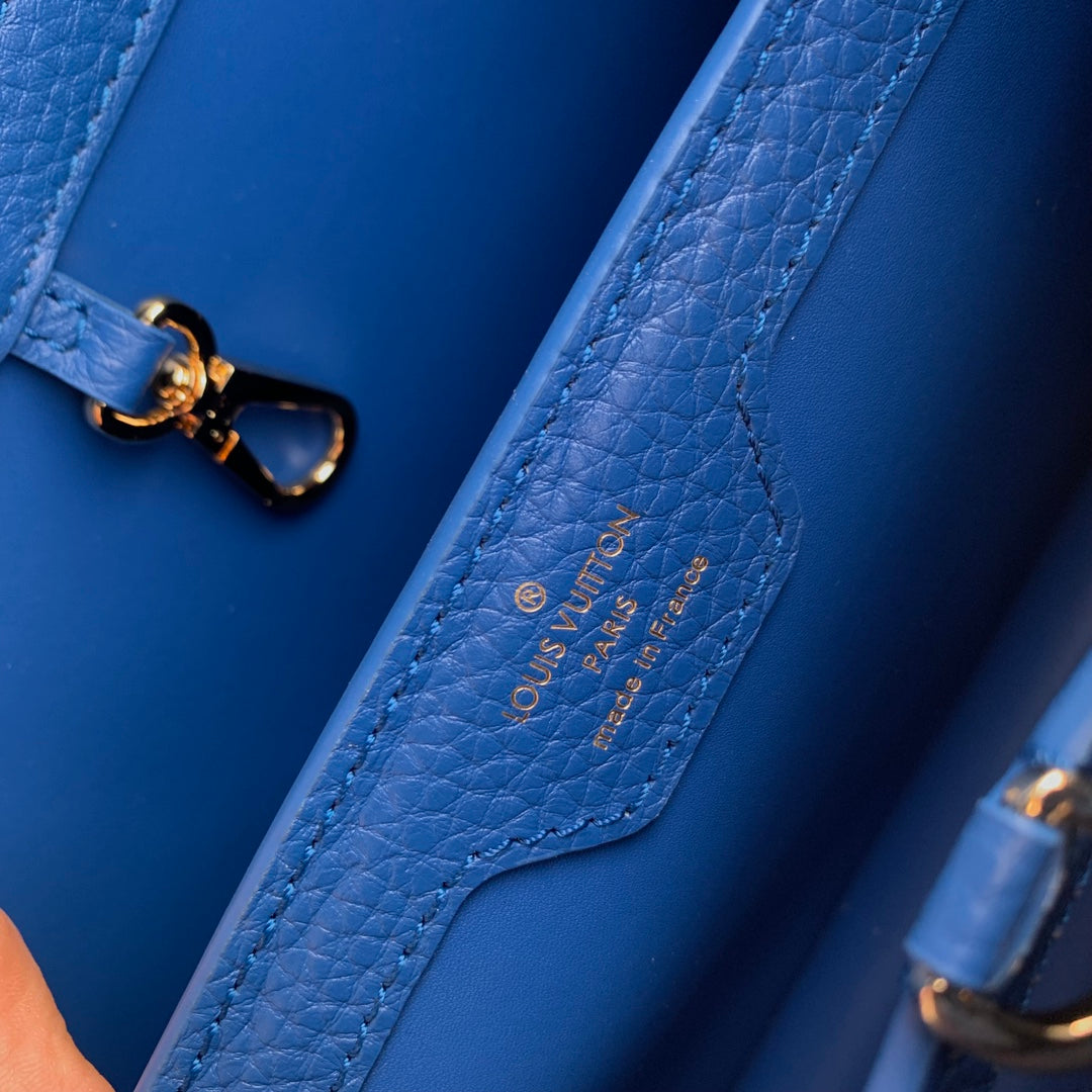 capucines mm 31.5 cobalt blue taurillon leather gold hardware