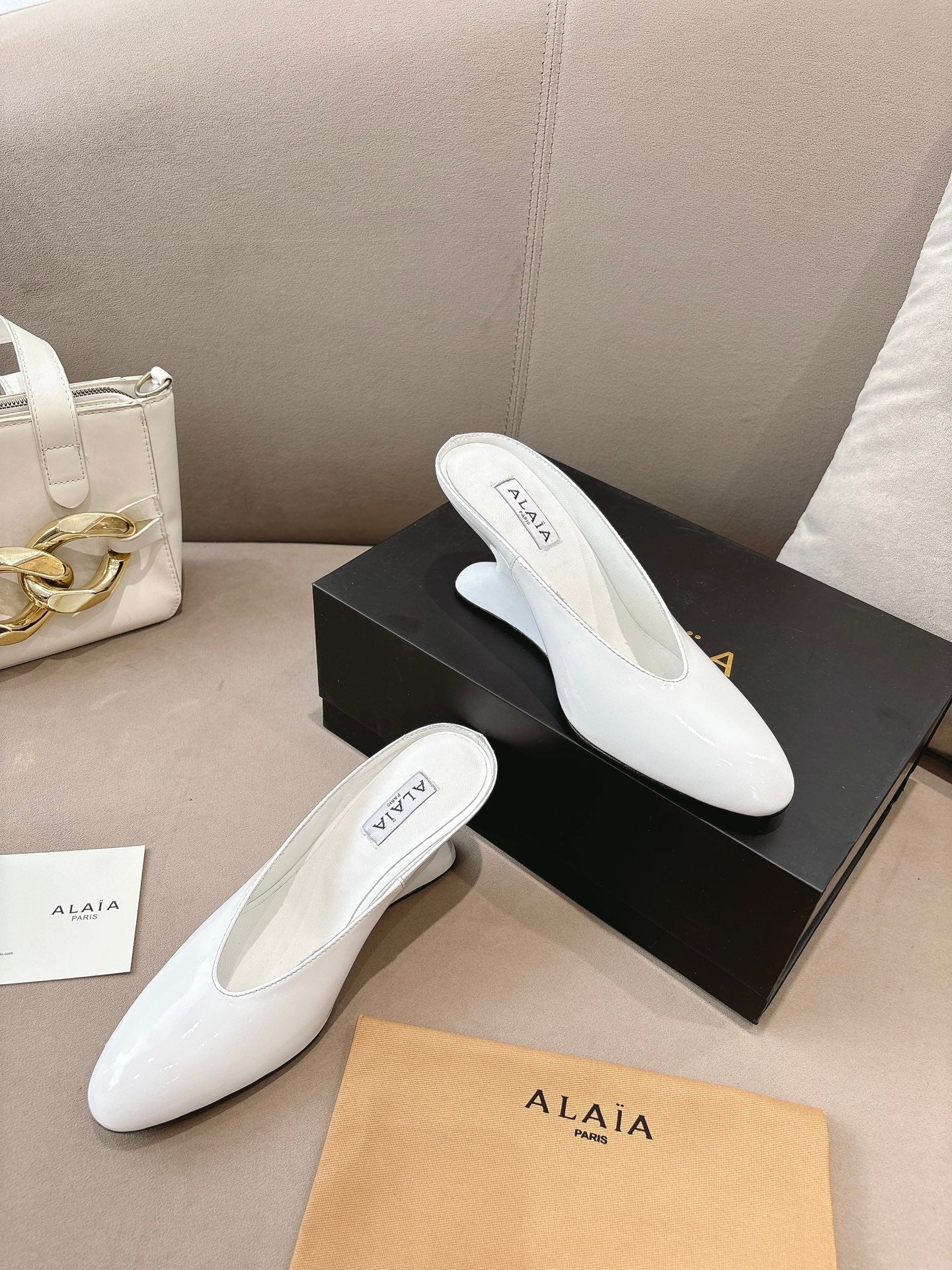Alaia 25 Curve Wedge Mules White Lambskin 293554