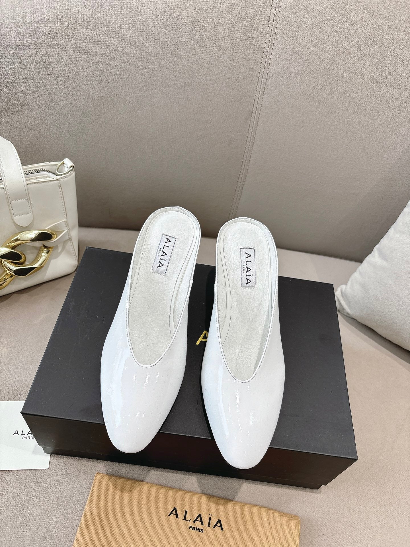 Alaia 25 Curve Wedge Mules White Lambskin 293554