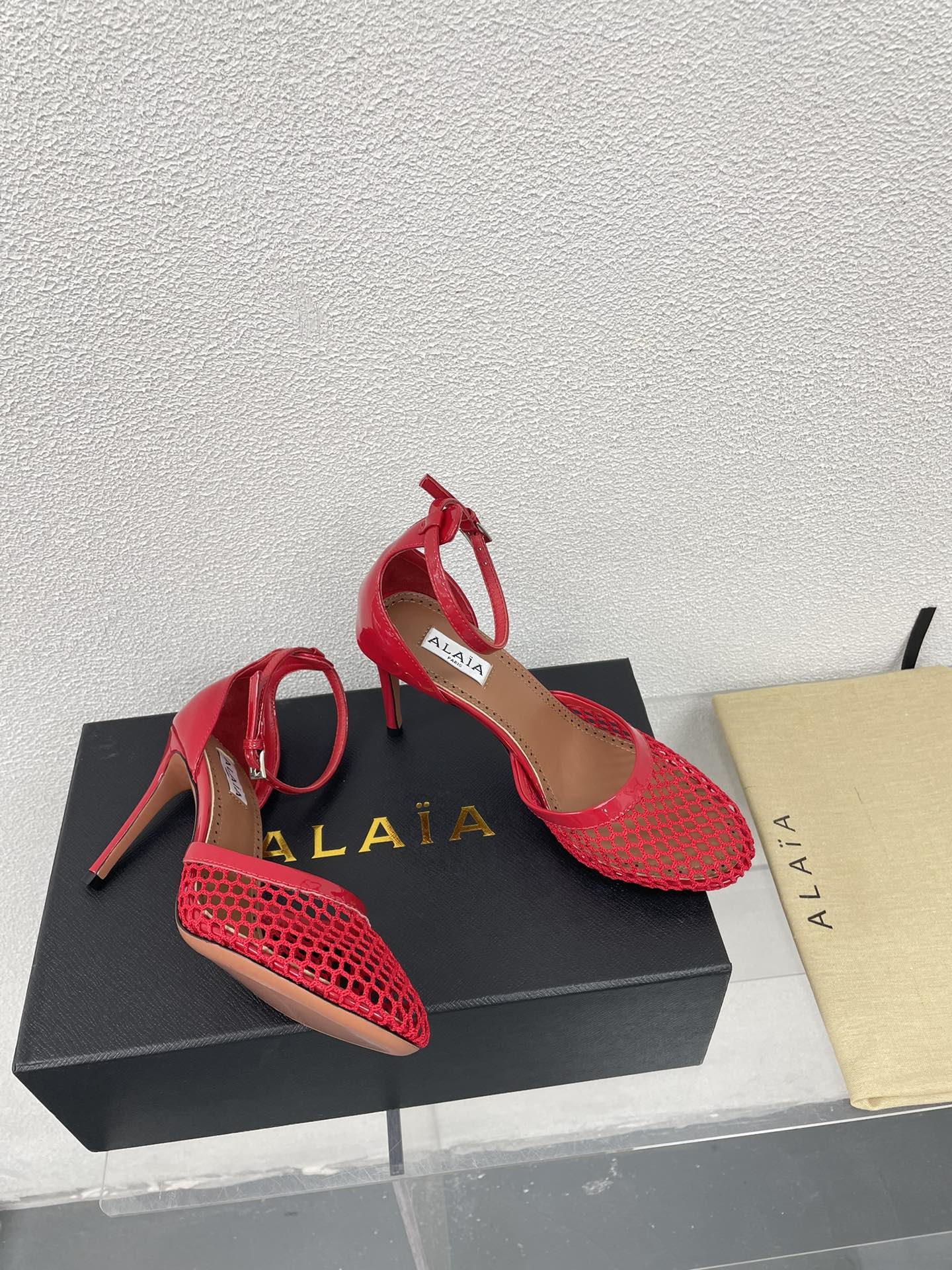 ALAIA HIGH FISHNET 9 CM PUMPS IN CHERRY RED MESH