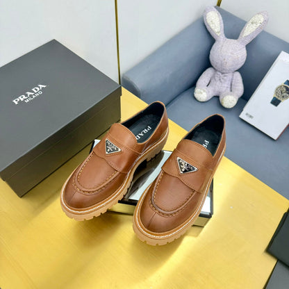LOAFER WITH TRIANGLE LOGO IN COGNAC CALFSKIN