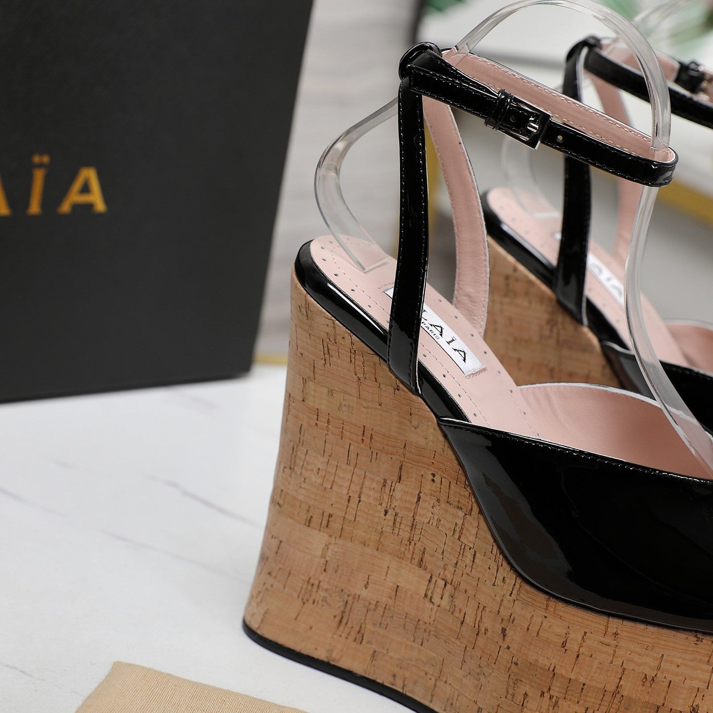 ALAIA WEDGE SANDAL IN BLACK GLOSSY CALFSKIN AND BEIGE RUBBER
