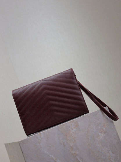 CASSANDRE CLUTCH 21 IN BORDEAUX RED LAMBSKIN GOLD HARDWARE
